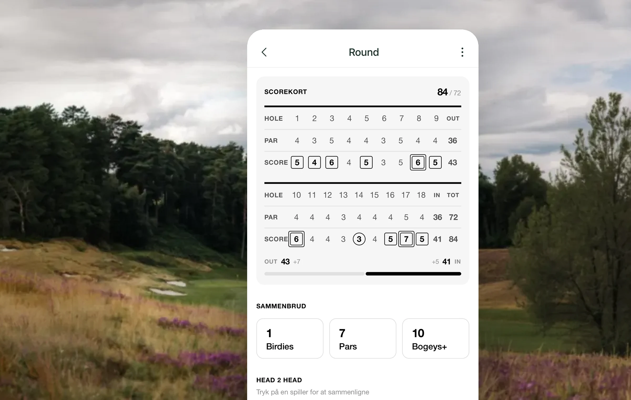 A Golfsocial round scorecard on a phone, floating over a moody Danish golf course